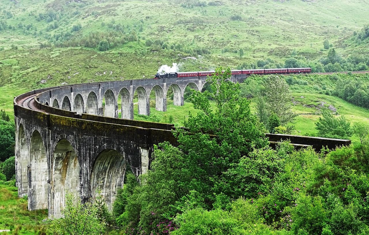 A steam train crossing the Glenfinnan Viaduct in the Scottish Highlands