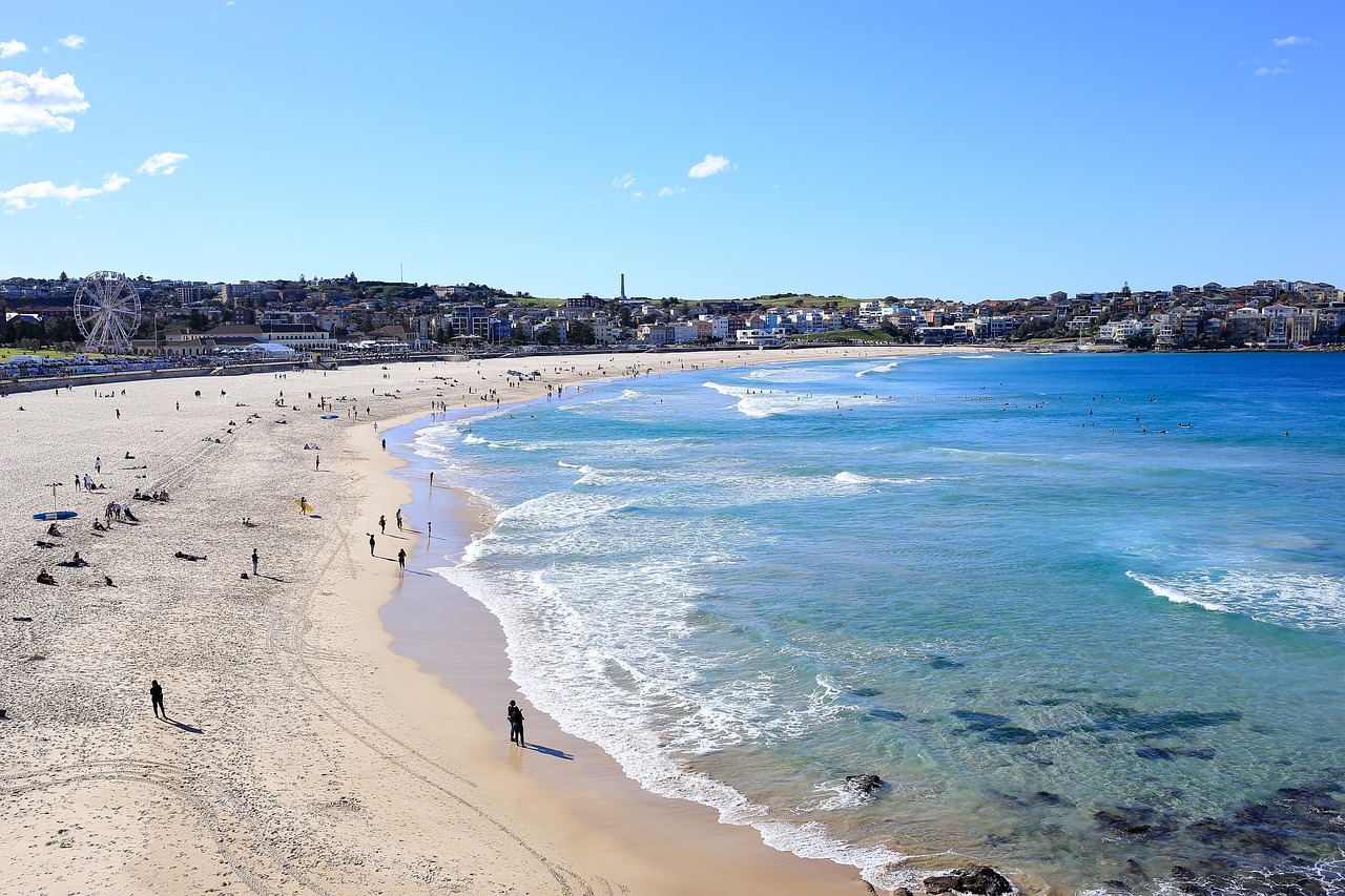 Bondi Beach in Sydney on a sunny day, with surfers in the water